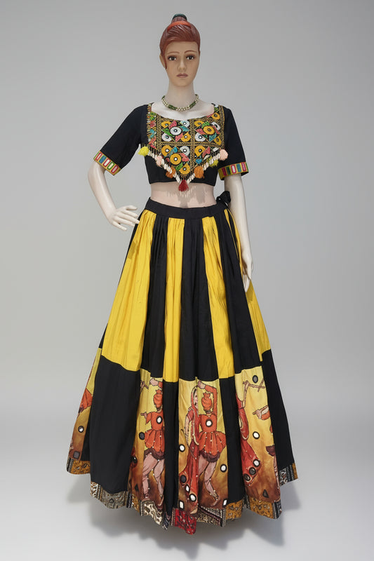 Traditional outfit with black and yellow design on a mannequin against a beige background, Rental cloths from ClosFit Surat.