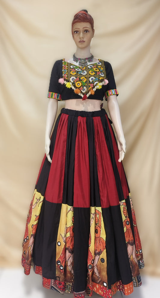 Mannequin wearing a traditional outfit with a black blouse and red skirt against a beige background. Rental cloths from ClosFit Surat.